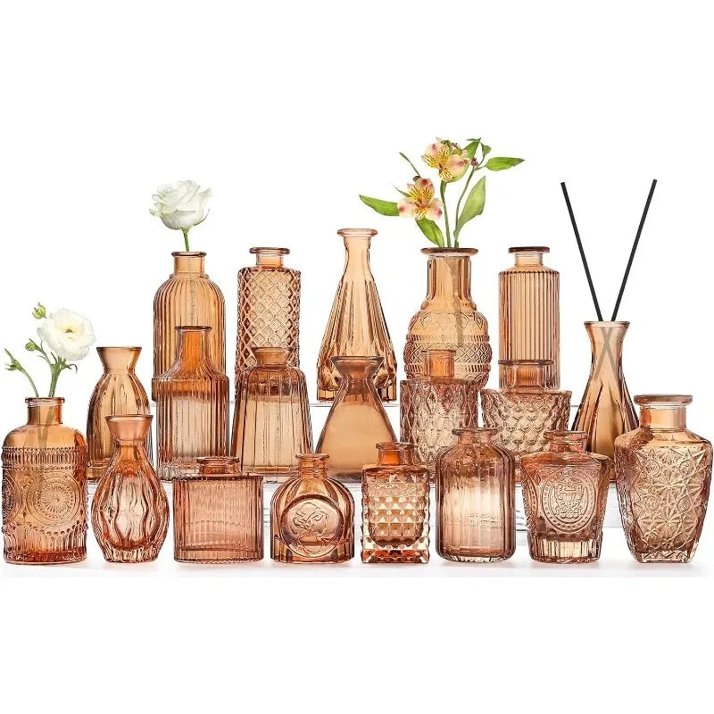 Twenty Amber Vases on a white surface