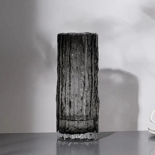 Black Glass Vase on a gray table with a white background