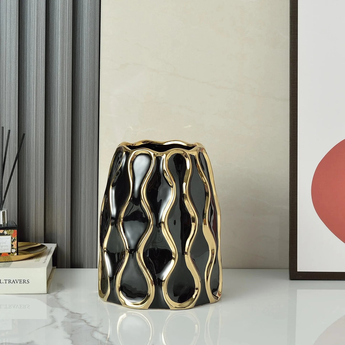 Medium sized Black Modern Vase on a marble table next to an image frame