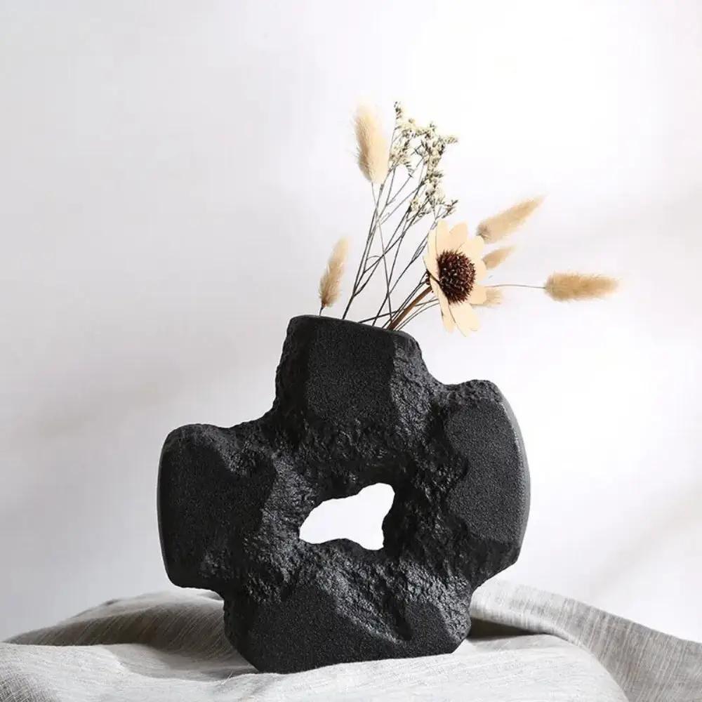Black Stone Vase With Flowers Inside
