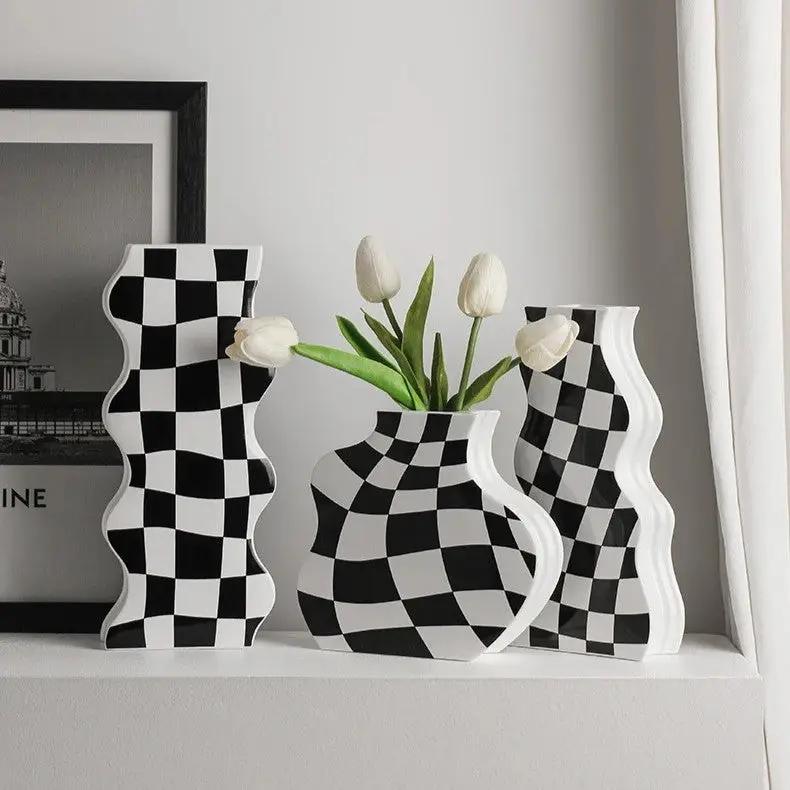 Black and White Vases in Small, Medium and large with flowers inside