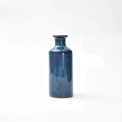 Medium Blue Bud Vase on a white surface