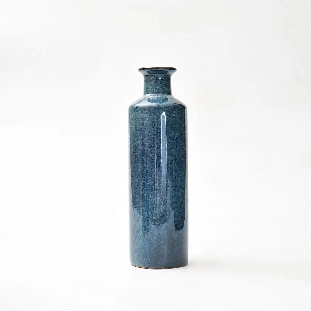 Large Blue Bud Vase on a white surface