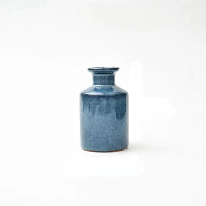 Small Blue Bud Vase on a white surface