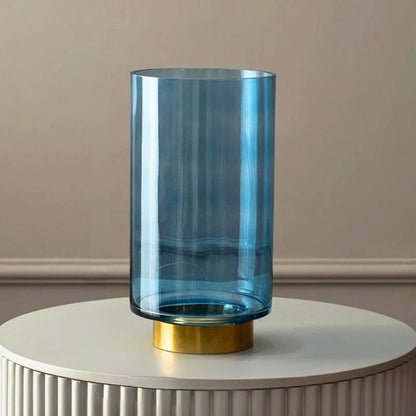 Larage Blue Glass Cylinder Vase on a white podium