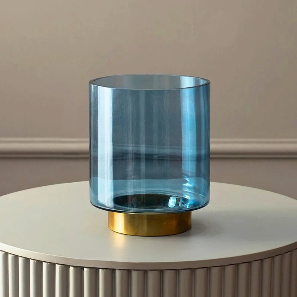 Blue Glass Cylinder Vase on a white podium 