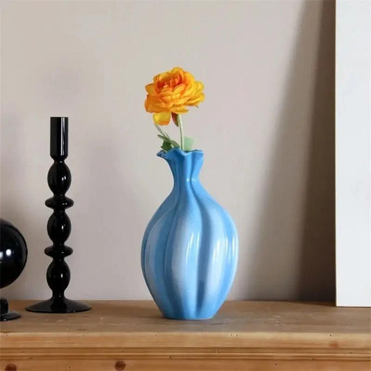 Blue and White Vase with an orange flower inside