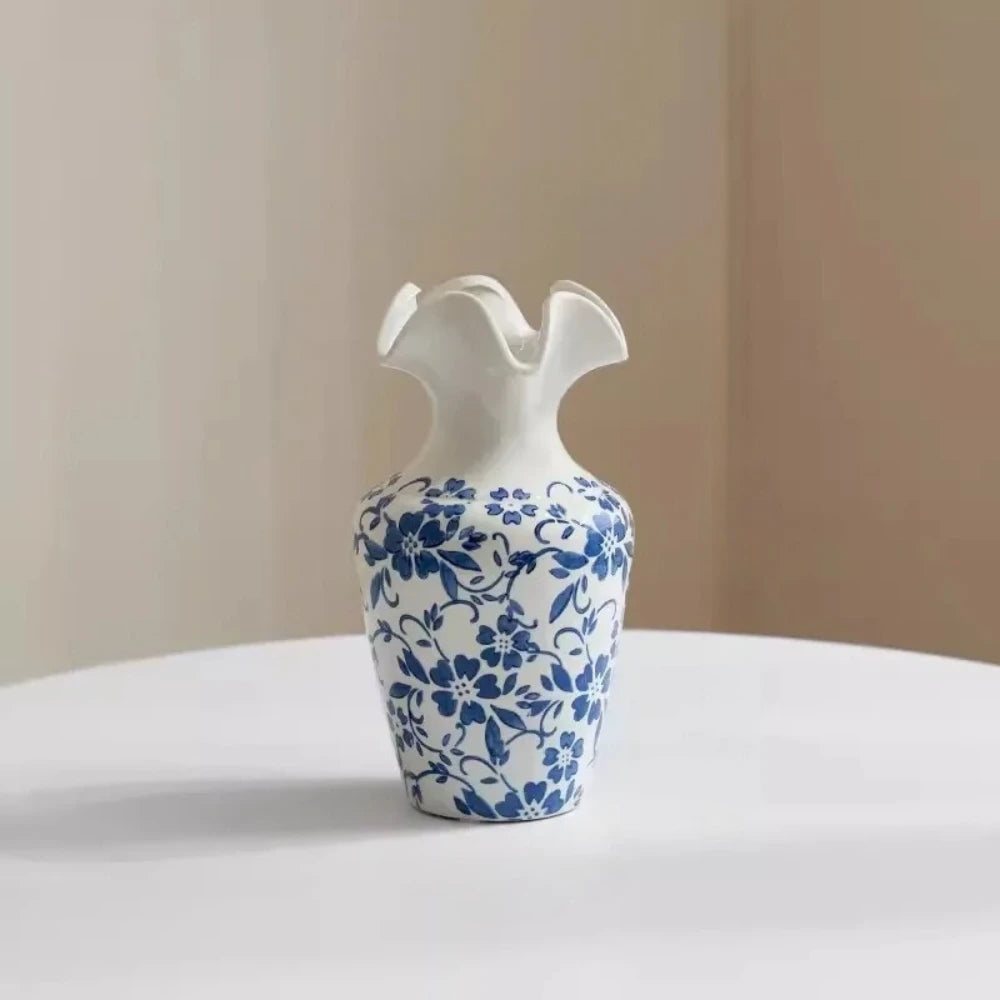 Medium Blue and White Vase on a white surface