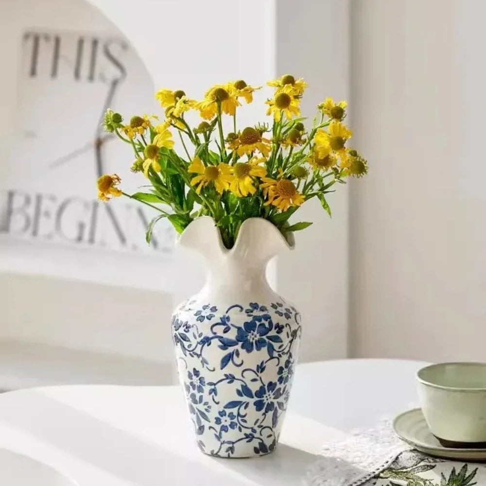 Medium sized Blue and White Vase with yellow flowers inside 