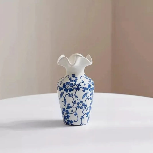 Small Blue and White Vase on a white surface