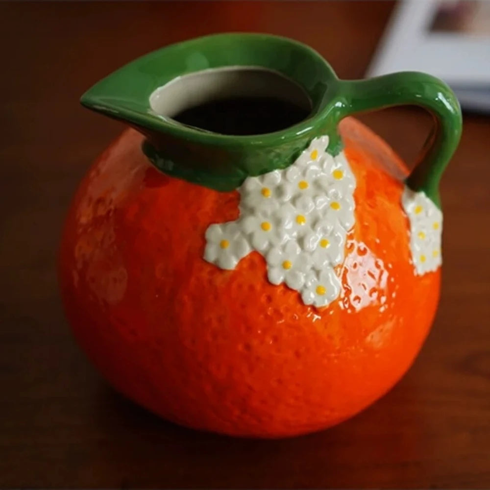 Bright Orange Vase on a wooden table