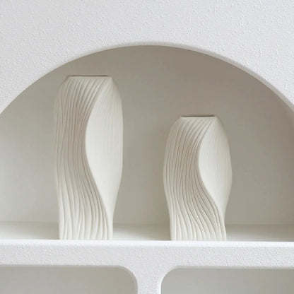 Ceramic Bud Vases in large and medium on a white shelf