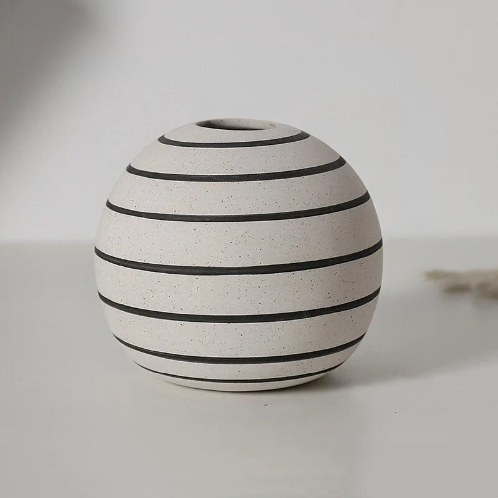 Medium sized Ceramic Round Vase on a grey table