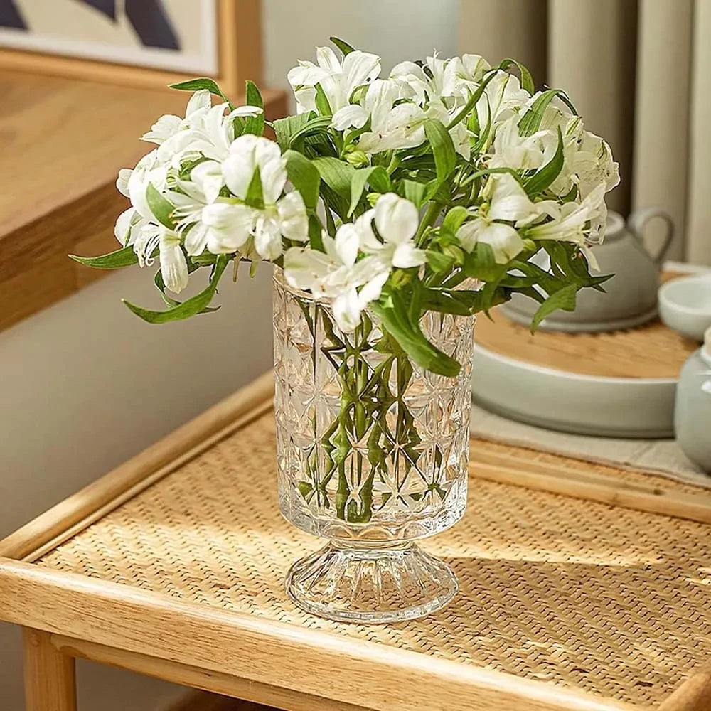 Crystal Pedestal Vase on a wooden table with white flowers inside