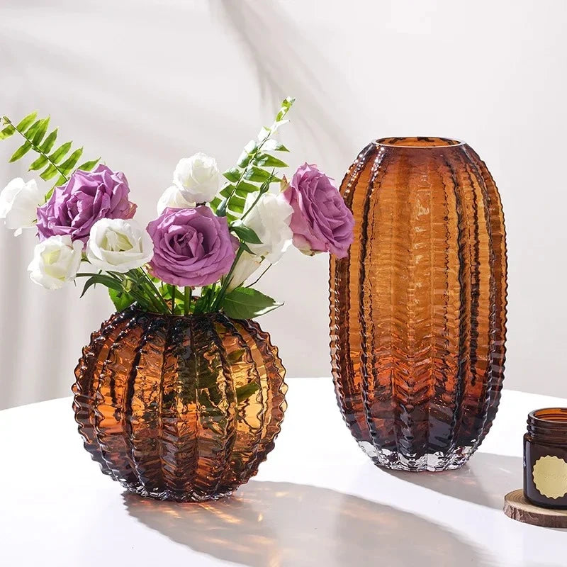 Two Dark Brown Vases with purple and white vases inside