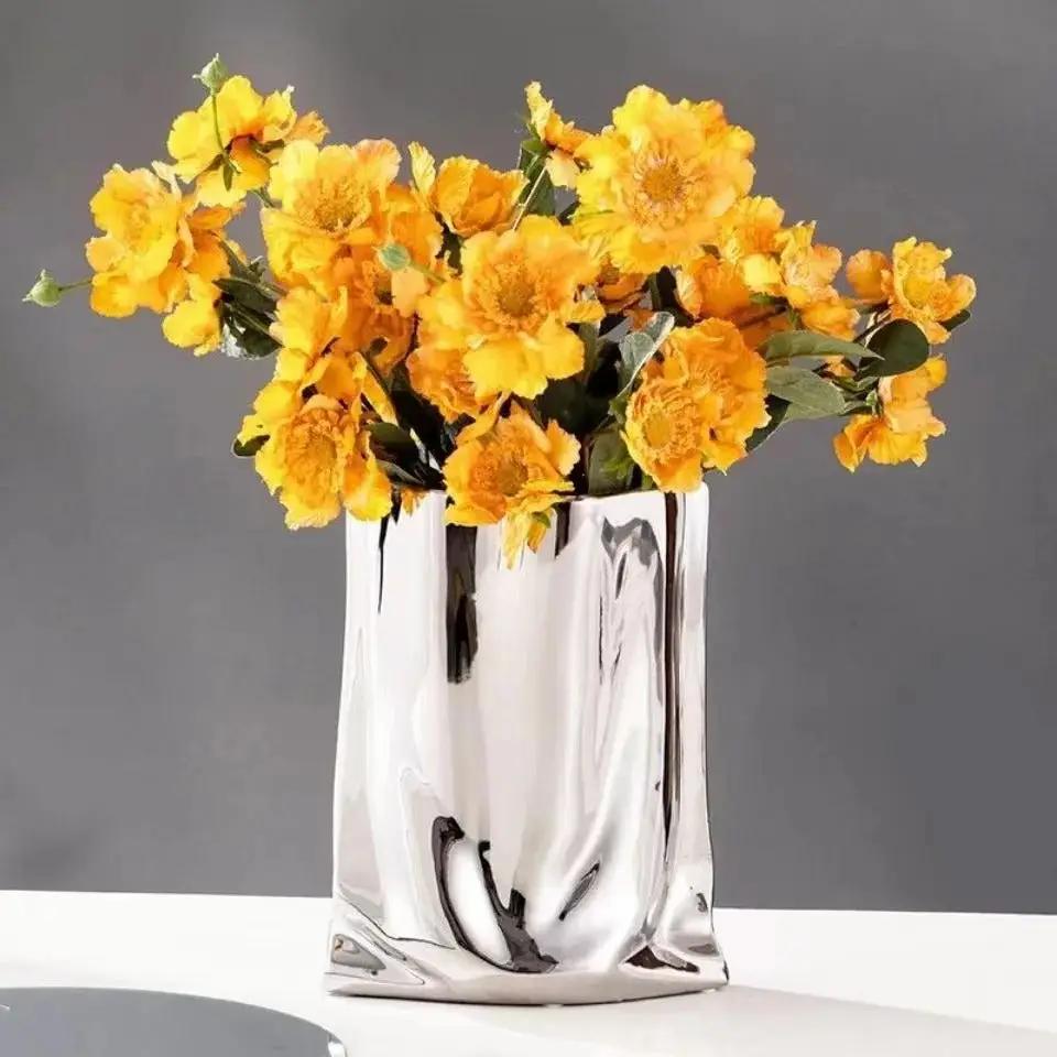 Flower Silver Vase With Yellow Flowers Inside