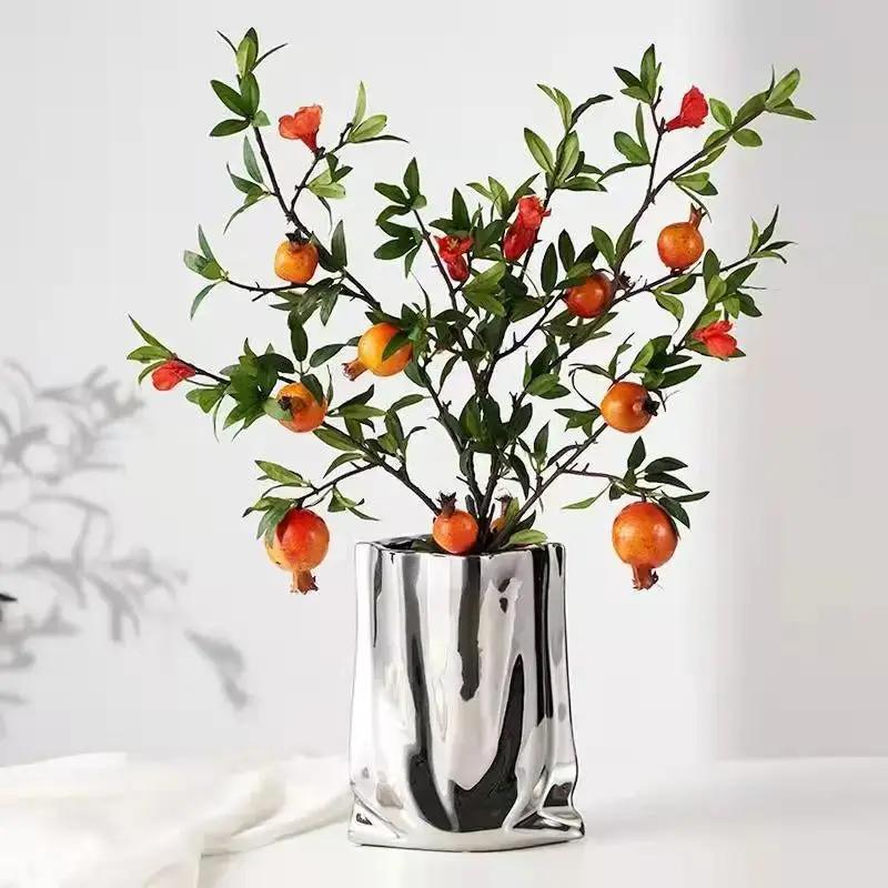 Flower Silver Vase With Orange Plants Inside