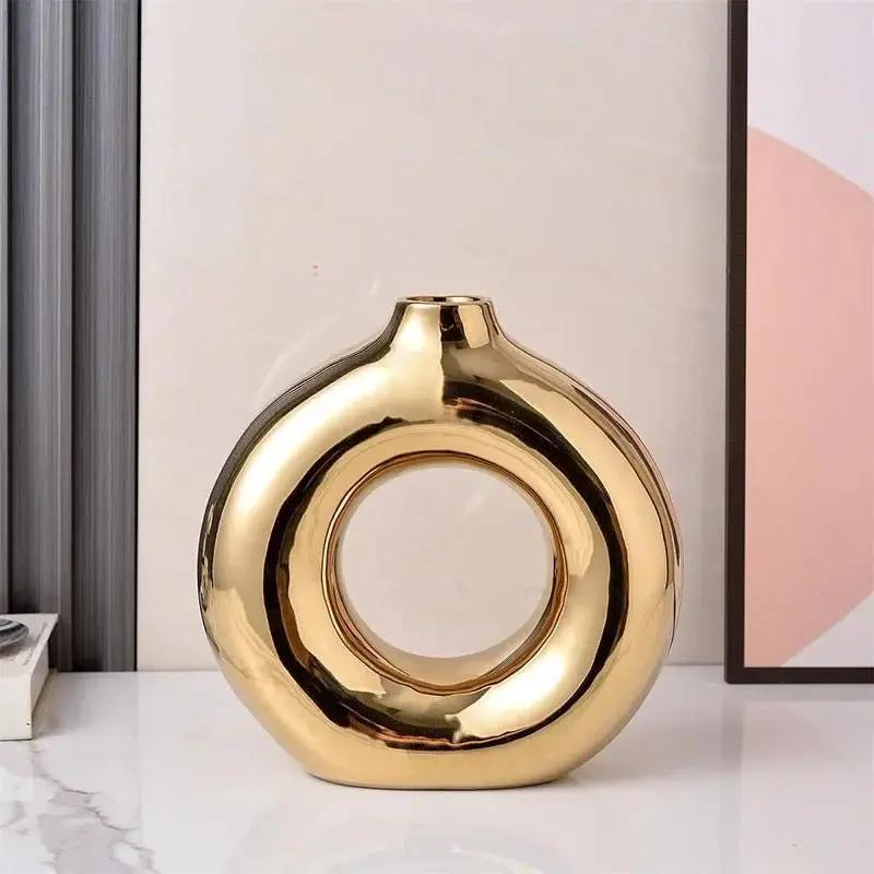 Large Gold Bud Vase on a white surface