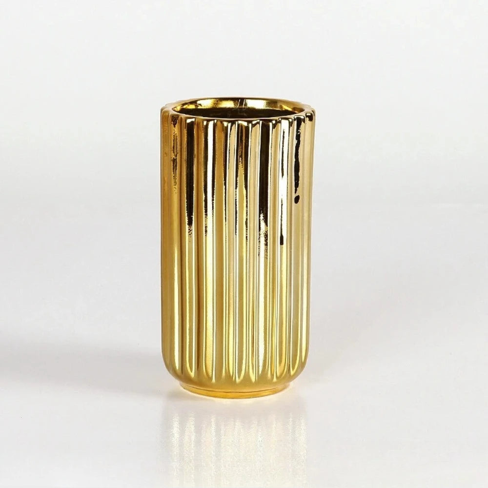 Small Cylinder Gold Vase on a white surface