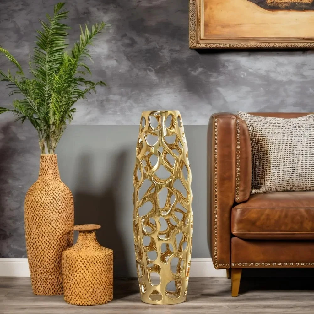 Gold Floor Vase next to a couch and vases