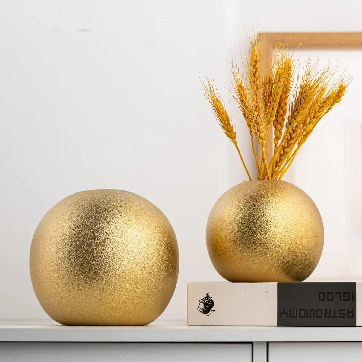 One Large and One Medium Sized Gold Round Vases
