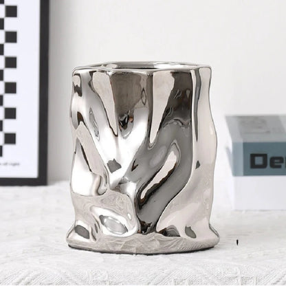 Silver vase on a white surface