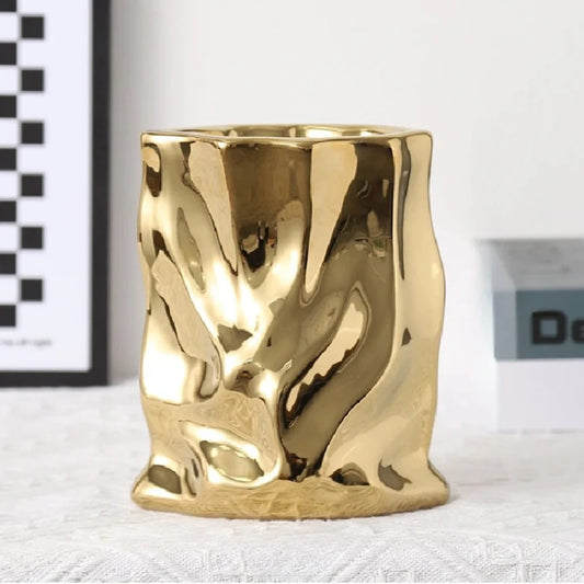 Gold Vase on a white surface