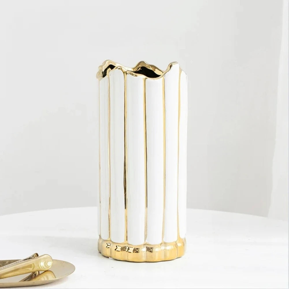 Medium sized Gold and White Vase on a white surface