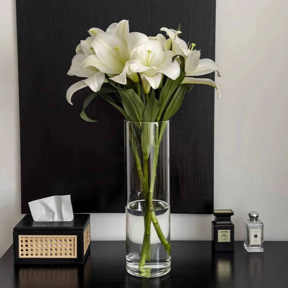 Large Cylinder Vase on a black wooden table next to a tissue box and parfums 