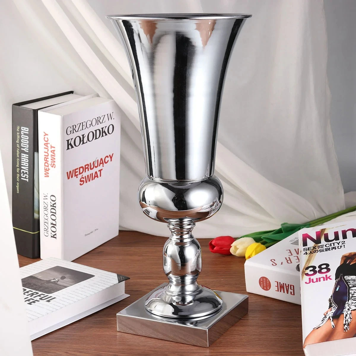 Large Silver Vase on a brown wooden table 