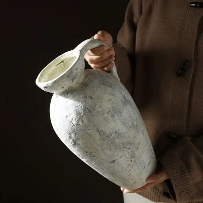 Person holding a Large Stone Vase