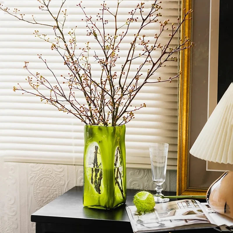 Lime Green Vase with decoration inside on a black dresser