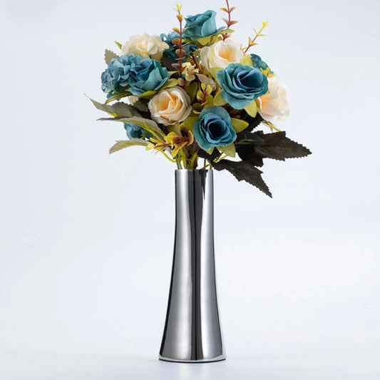 Metal Silver Vase on a white background with flowers inside