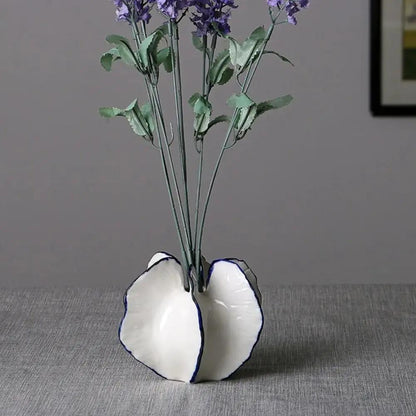 Medium Milk White Vase with flowers inside on a gray background