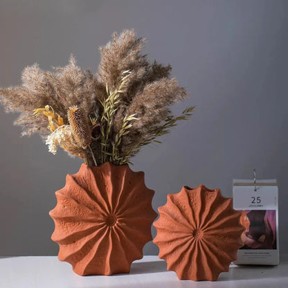 Two Orange Vase Decor sets on a white surface 