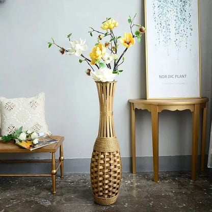 Oriental Floor Vase next to a bench and a table with an image frame on it 