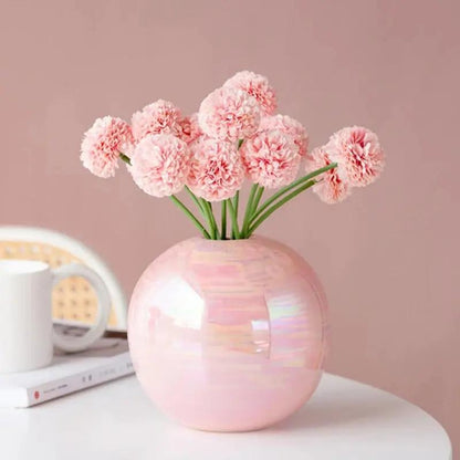 Pink Bud Vase with pink flowers inside on a rose pink background