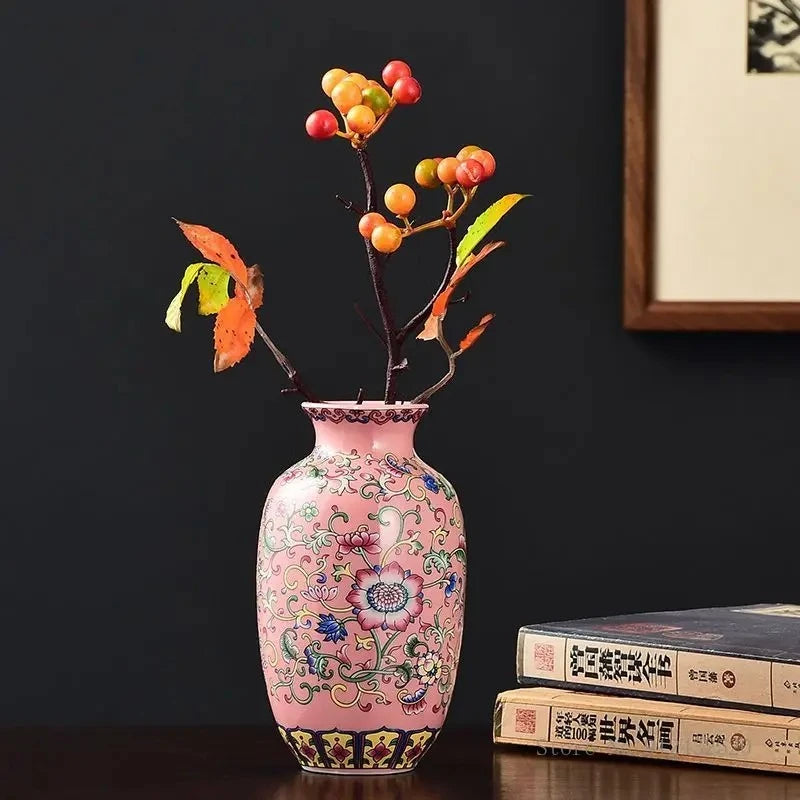 Pink Vase standing on a wooden table next to japanese books