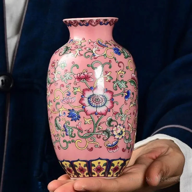 Person holding a Pink Vase