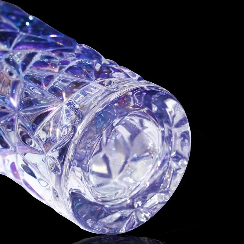 Bottom of a Purple Crystal Vase on a shiny black surface