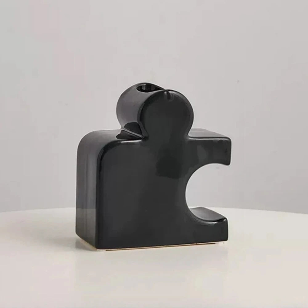 Black Puzzle Vase on a white surface