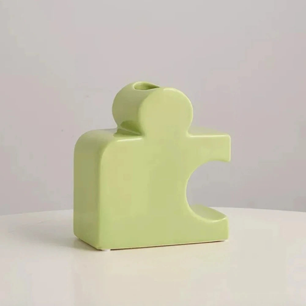 Green Puzzle Vase on a white surface