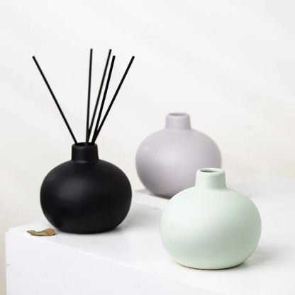 Three Round Small Vases with decoration inside