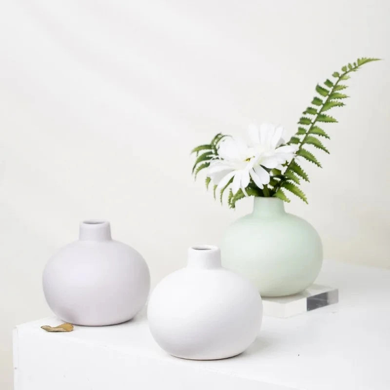 Three Round Small Vases with greenery inside