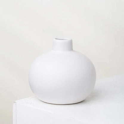 Round Small Vase in white on a white surface