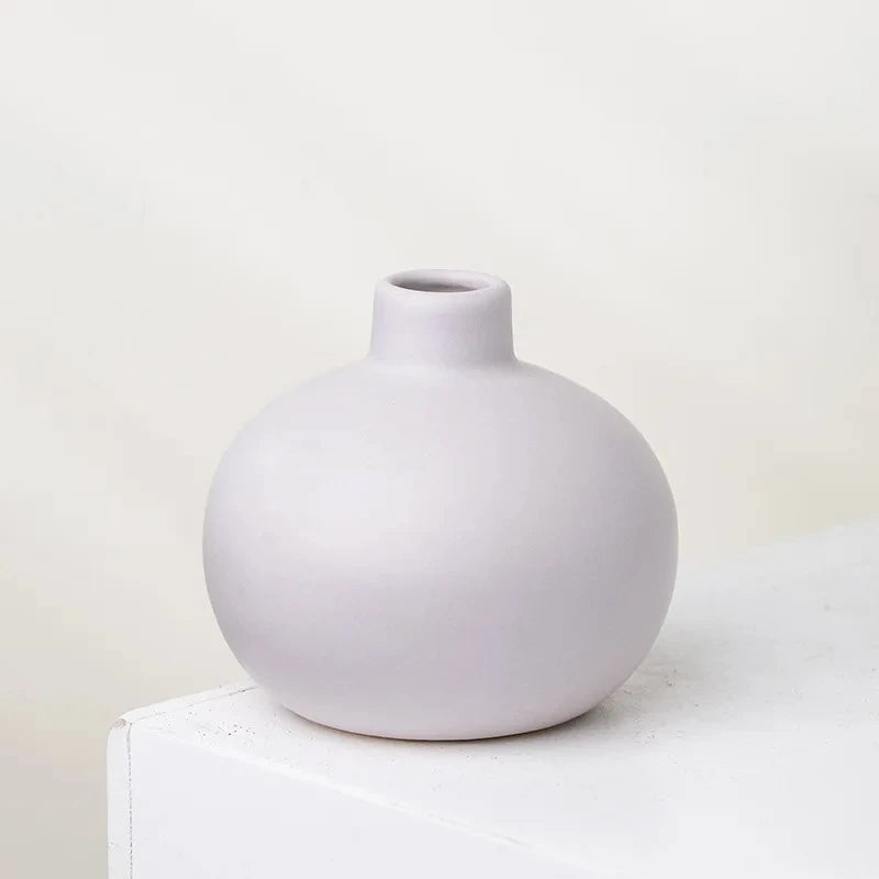 Round Small Vase in lavender on a white surface