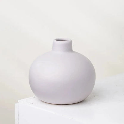 Round Small Vase in lavender on a white surface