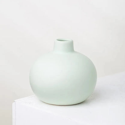 Round Small Vase in mint green on a white surface