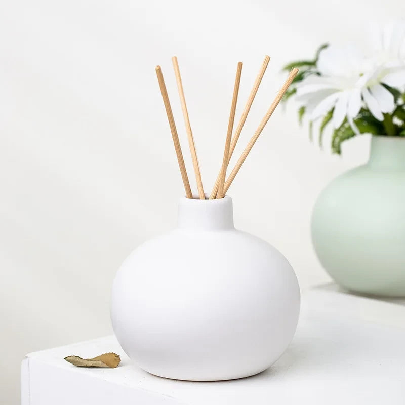 Round Small Vase in white with decorational element inside