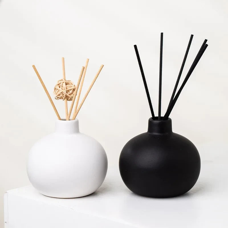 Two Round Small Vases in white and black with decoration inside